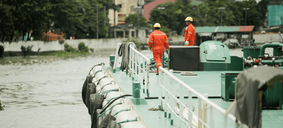 two male workers and experts monitoring machine condition